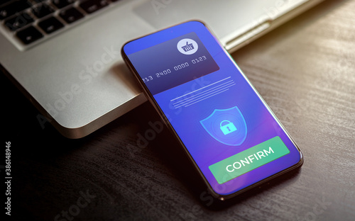 Mobile Payment and online shopping via virtual mobile banking. Pay wireless by credit bank card via electronic wallet or m-banking app. Smart phone with payment confirmation on the screen