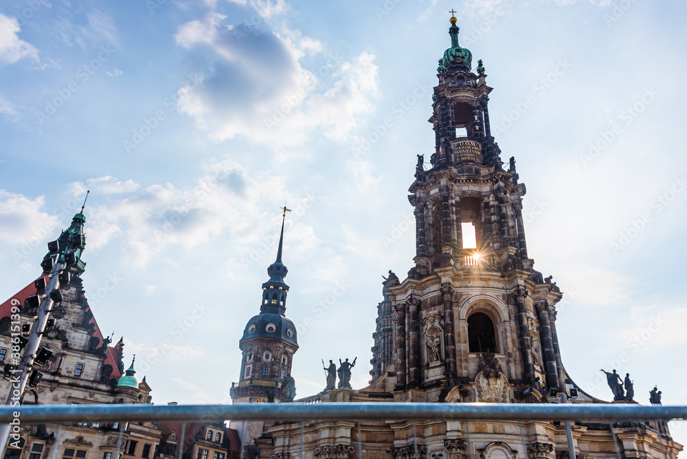 Fototapeta premium The catholic baroque Cathedral of the Holy Trinity seen through the fence with rays of light . Dresden, Saxony, Germany, Europe.