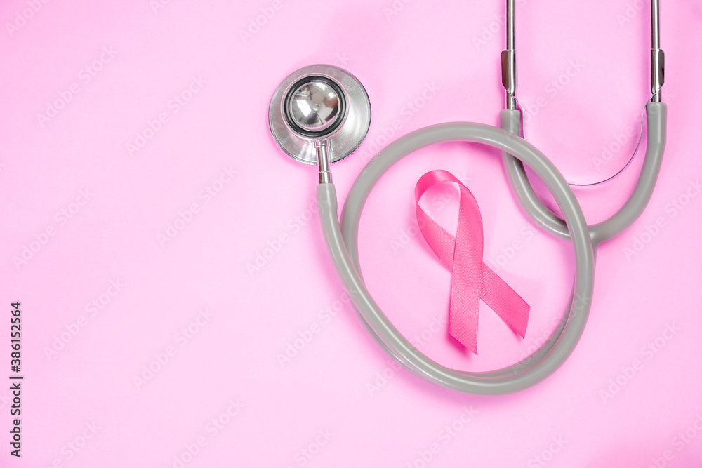 Fototapeta premium breast cancer awareness ribbon on pink background