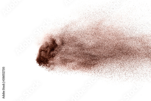 Brown powder explosion isolated on white background.