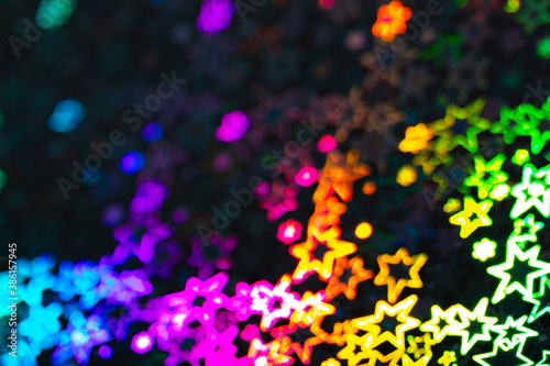 Blured rainbow holographic stars abstract patterned background
