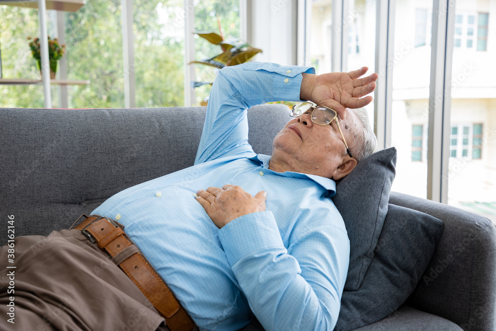 A retired old man is stressed out by getting sick on the couch in that room after he was diagnosed with high blood pressure and cancer. A retired old man is stressed out by getting sick on the couch in that room after he was diagnosed with high blood pressure and cancer.