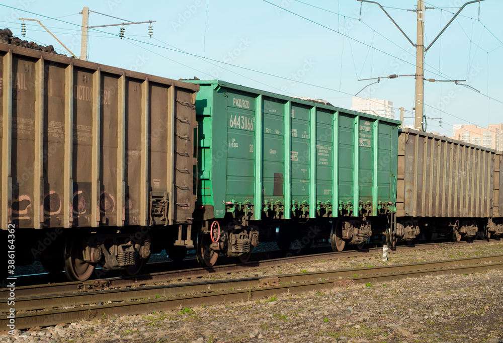 freight Cars in a moving freight train. Transportation by rail. Russia Krasnoyarsk, October 17, 2020 freight Cars in a moving freight train. Transportation by rail. Russia Krasnoyarsk, October 17, 2020