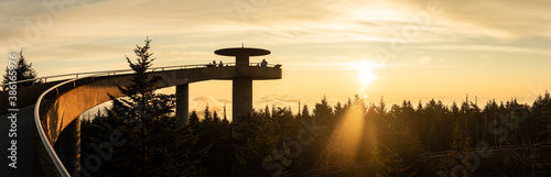 Photography Sunrise with silhouette of concrete round lookout tower in smoky mountains