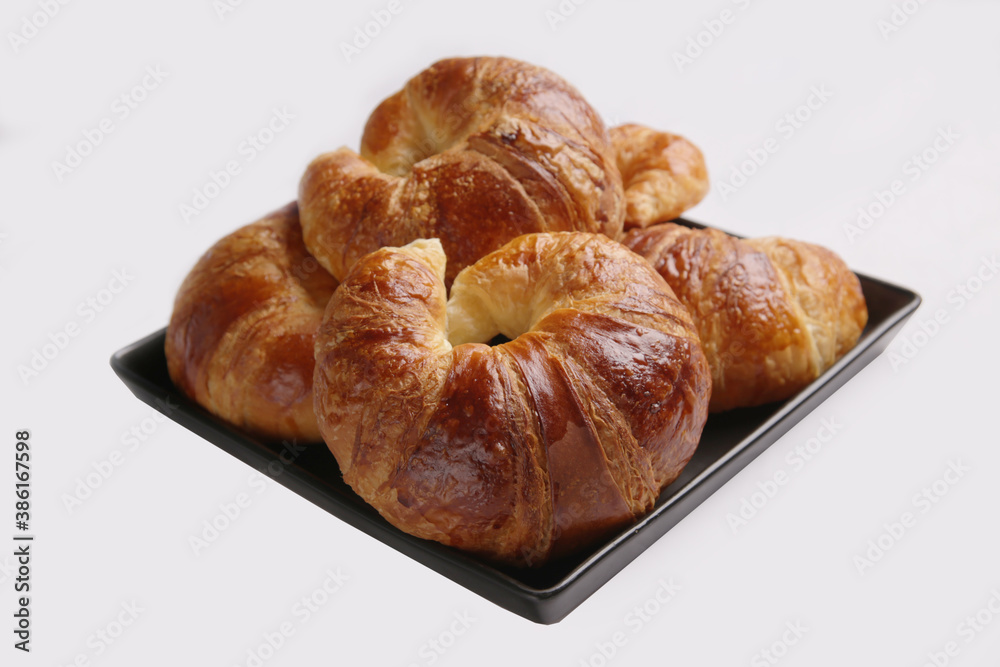 baked croissants on white background