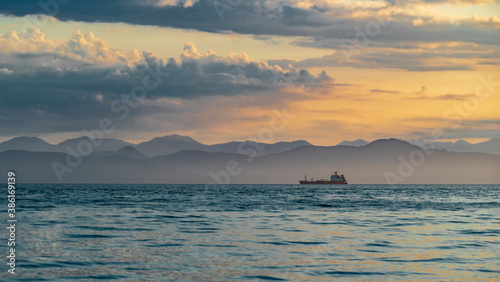 Kamchatka. Sunset on Avacha Bay with a ship on the horizon. Petropavlovsk Kamchatsky.