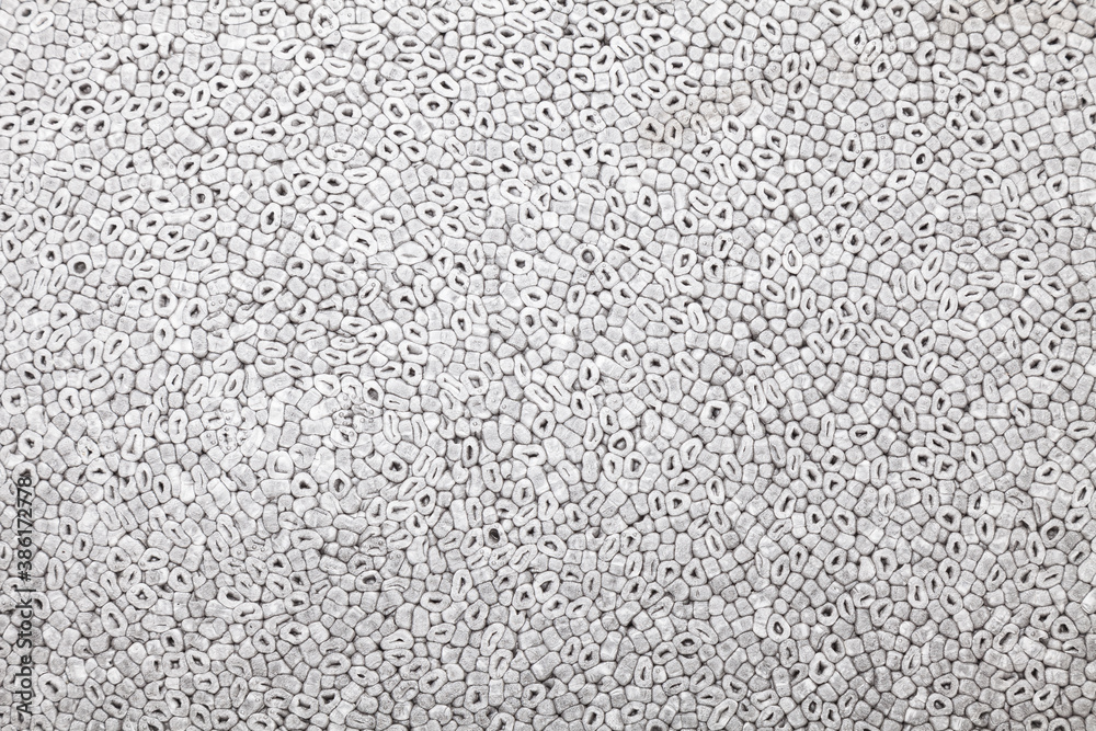 Background and texture of gray soft foam with round chips. Styrofoam. Background and texture of gray soft foam with round chips. Styrofoam.