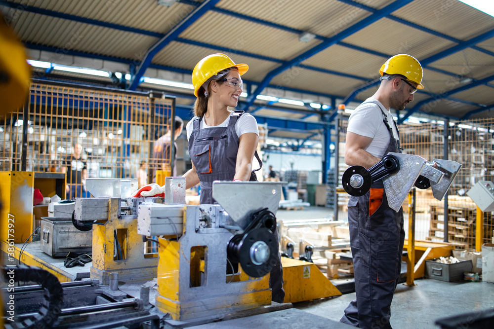 Industrial employees working together in factory production line. Industrial employees working together in factory production line.
