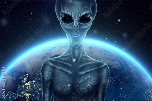 Cuadro en lienzo A gray alien, humonoid, with black large glass eyes against the background of the globe
