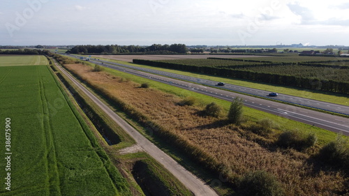 Motorway with few cars, near the exit of Fijnaart in Brabant south of the Netherlands in Europe.