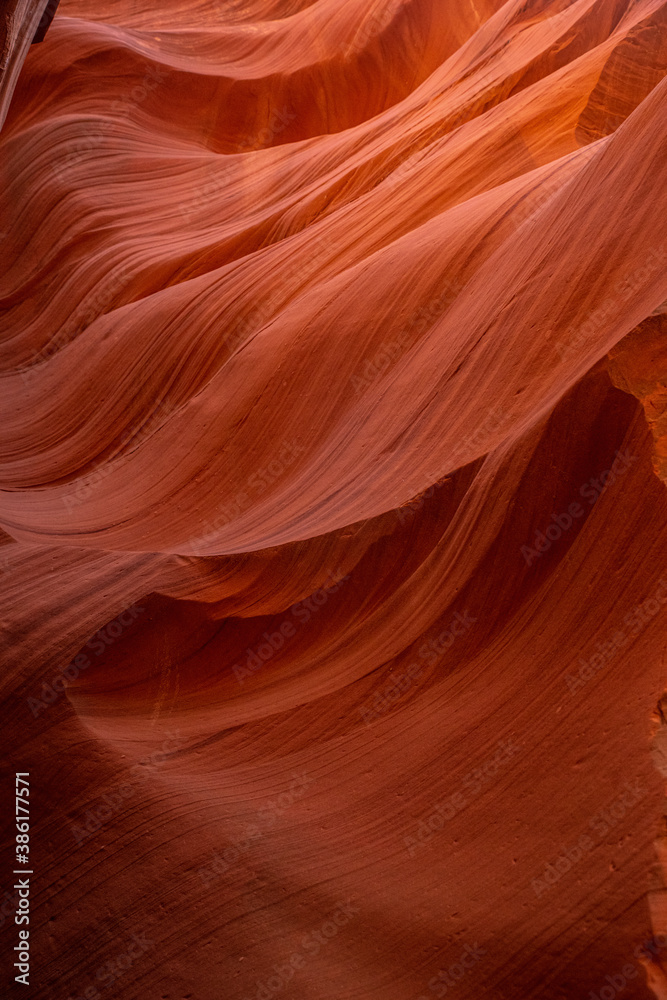Vertical shot of red rock formation in Antelope Canyon, unusual bewitching pattern