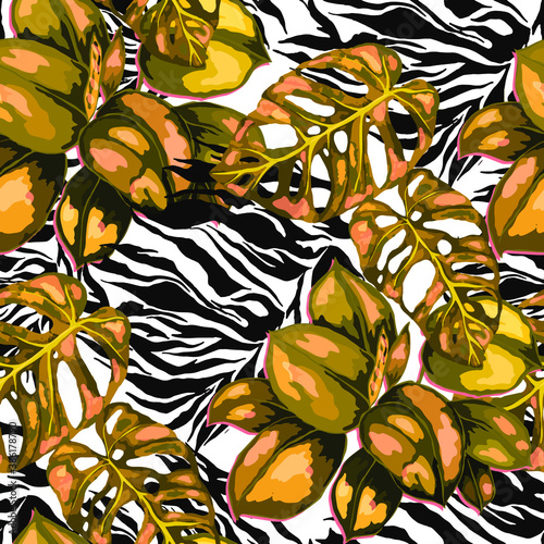 Tropical seamless pattern on animalistic texture. Jungle exotic summer print. Summer tropical leaf. Tropical flower fashion pattern. Floral tropic illustration. Vector seamless pattern.