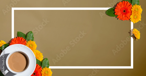 Autumn flower theme with a cup of coffee - overhead view flat lay