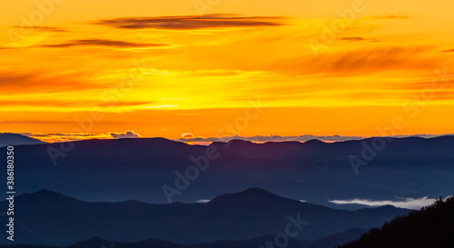 A new day begins, we see an early sunrise observed from the peaks of the Apennine Mountains.