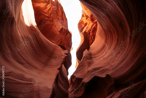Breathtaking view of curves of antelope canyon. The awesome winding fissure in the red rock with a sky view in Arizona