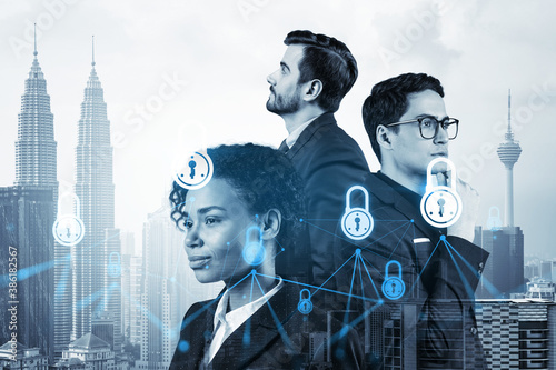 Photography Group of business colleagues as a part of multinational corporate team working on project to protect clients information at cybersecurity compliance division