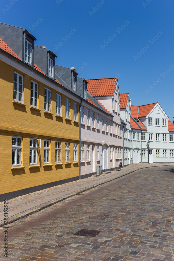 Cobblestoned street with historic houses in Ribe, Denmark