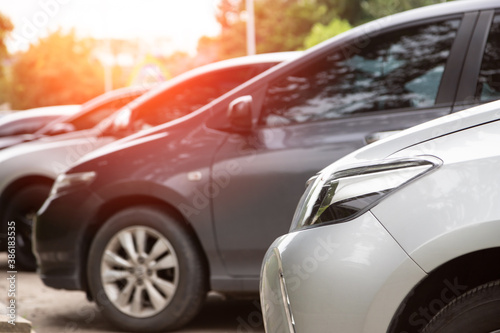 Close-up of front car parking in line with sunlight.