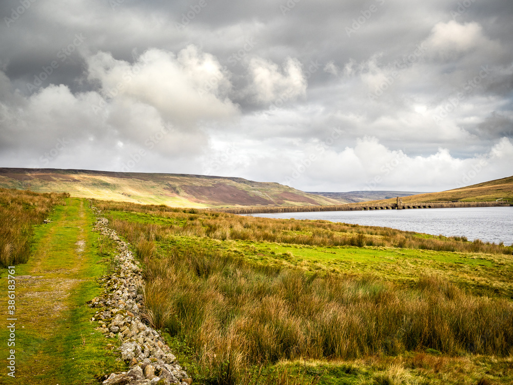 A country track winds its way through moorland around Scar House reservoir. Nidderdale. Yorkshire Dales A country track winds its way through moorland around Scar House reservoir. Nidderdale. Yorkshire Dales