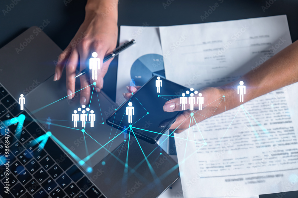 Social network theme hologram and a woman signing contract use phone. Multiexposure. Social network theme hologram and a woman signing contract use phone. Multiexposure.