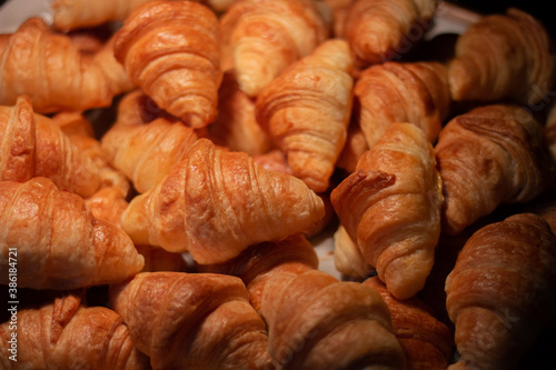 Group of Fresh Croissant in the bakery shop.