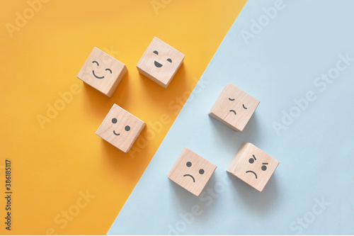 Foto Image of different emotions on wooden cubes.