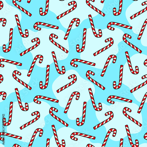 Candy canes isolated on blue background. Cute festive seamless pattern. Vector flat graphic hand drawn illustration. Texture.