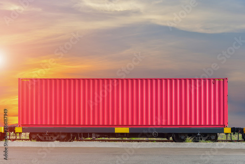 Freight Train with Cargo Containers, Transport, Shipping import Export on sunset sky background