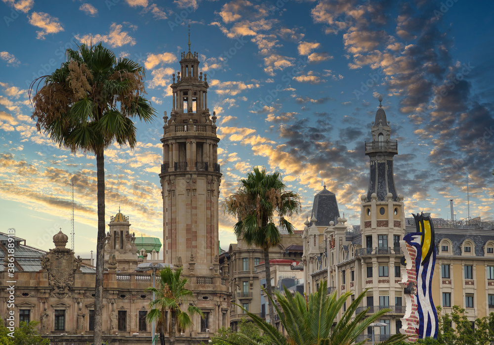 Naklejka premium photo of the typical central post and telegraph office in the Gothic Quarter of Barcelona at sunset.