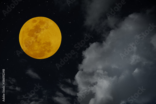 Full moon with blurred cloud on the sky.