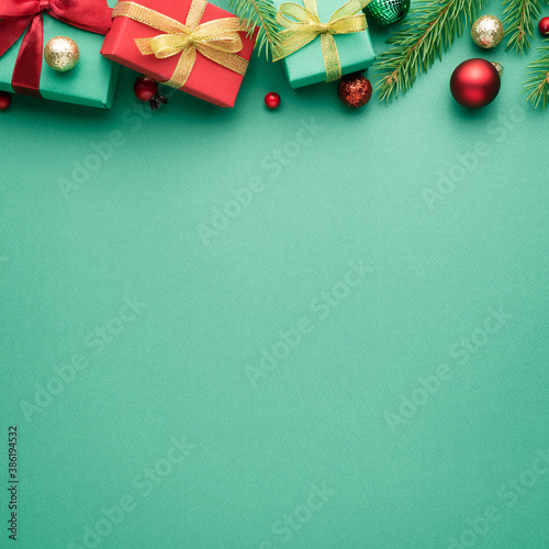 Square christmas card with fir decorations on turquoise background