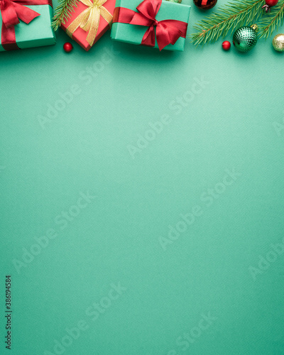 Christmas or New Year turquoise background with fir border