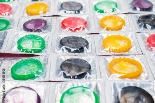 Colorful condoms background.