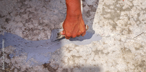 Obraz na plátně Repair of cracks in cement floor.