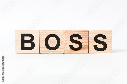 word BOSS on wooden blocks, white background, business concept. business and Finance