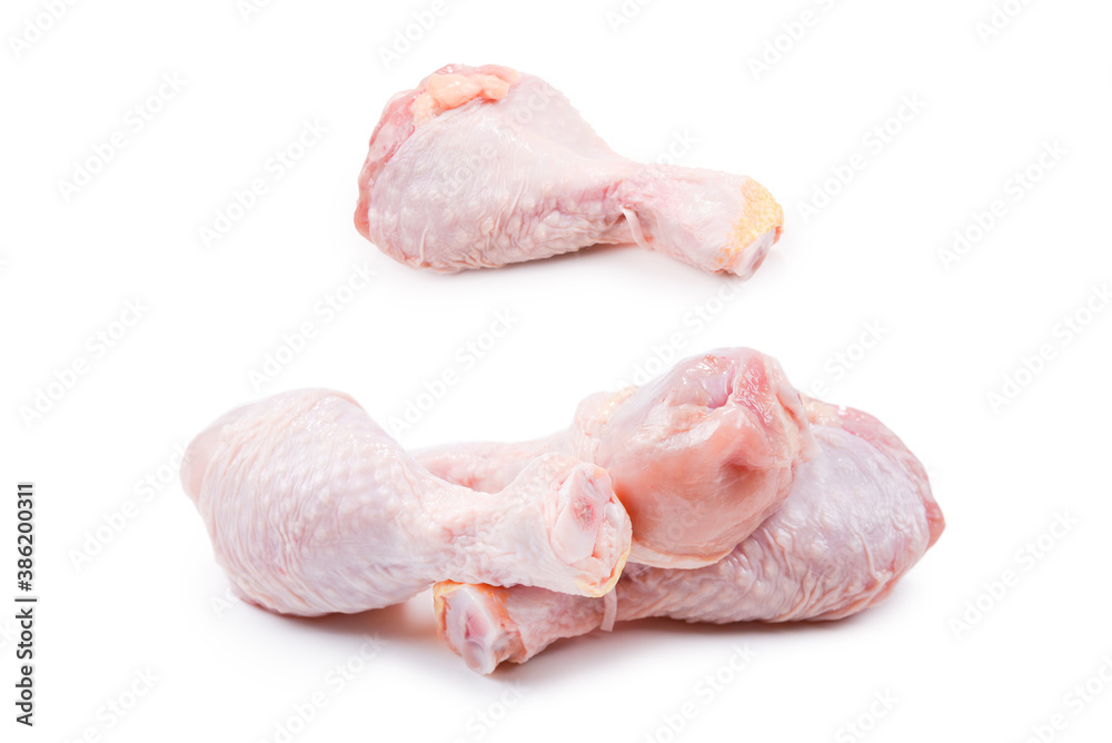 Tasty raw chicken legs. Top view. Isolated on white Tasty raw chicken legs. Top view. Isolated on white