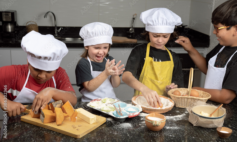 Kids having fun cooking pumpkin cupcake Kids having fun cooking pumpkin cupcake