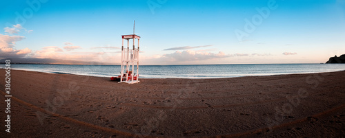View of a lifeguard tower at the beach of Poetto at Sunset