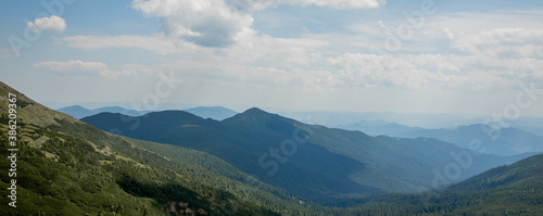 Carpathians mountain range at summer morning. Beauty of wild virgin Ukrainian nature. Peacefulness.