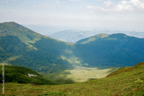 Carpathians mountain range at summer morning. Beauty of wild virgin Ukrainian nature. Peacefulness.