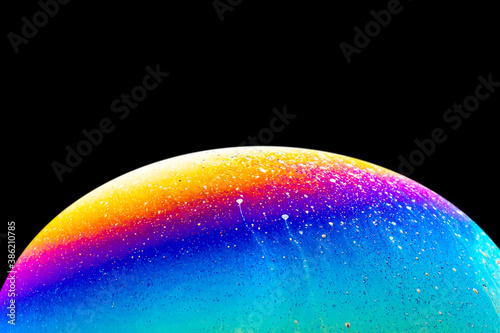 Soap bubble close up macro abstraction and planet imitation. Abstract background with colorful gradient colors.