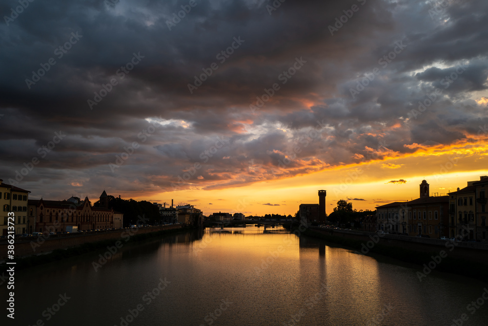 A sunset at the Arno in Pisa