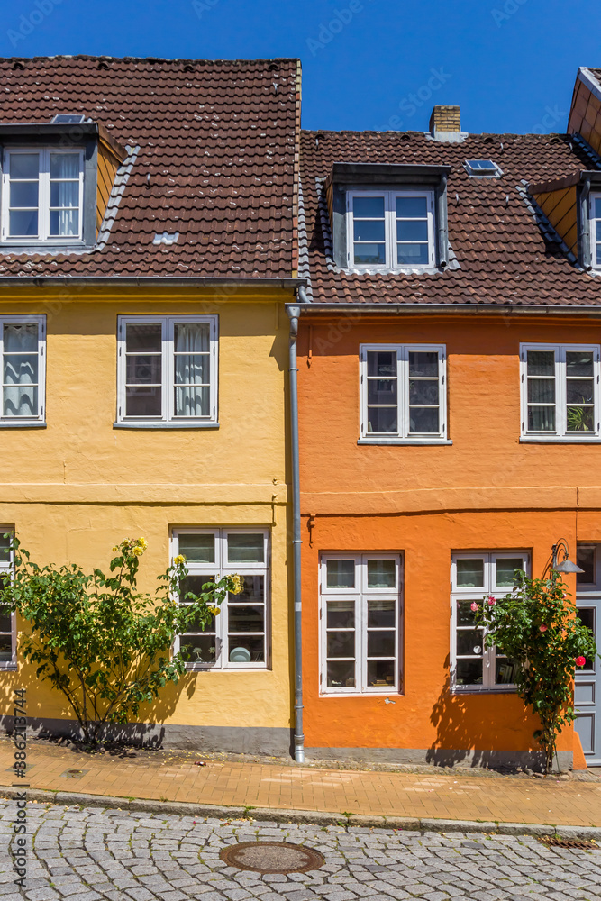 Orange and yellow house in historic city Flensburg, Germany