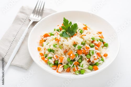 Boiled rice with vegetables, traditional Oriental dish