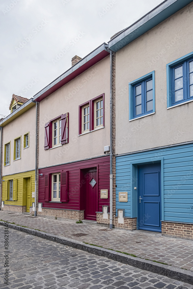 AMIENS, FRANCE - MAY 26, 2019: Beautiful old Colorful houses in Amiens old town. Amiens - city and commune in northern France, 120 km north of Paris, capital of Somme department, Hauts-de-France. AMIENS, FRANCE - MAY 26, 2019: Beautiful old Colorful houses in Amiens old town. Amiens - city and commune in northern France, 120 km north of Paris, capital of Somme department, Hauts-de-France.