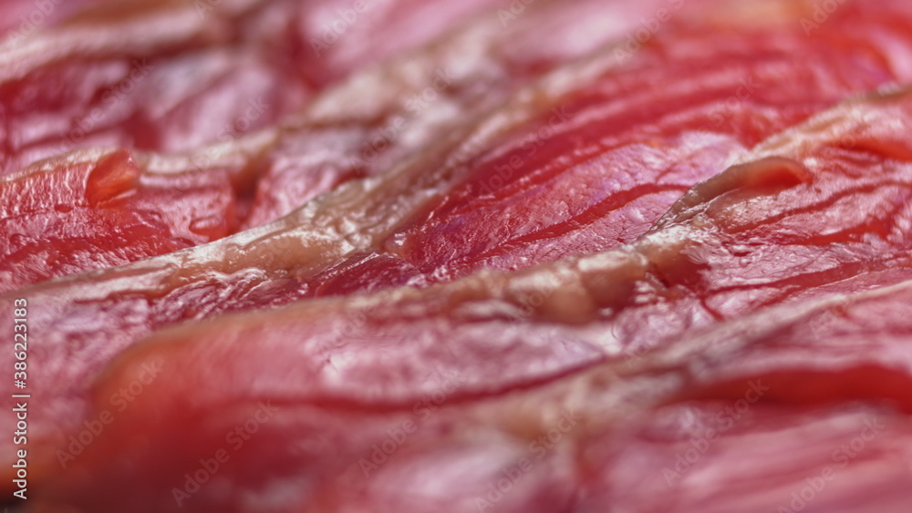 Close up shot of smoothly rotating salmon, Sushi cooking process - Philadelphia, burning fire smoking fresh raw red tuna salmon eel. Makro Close up shot of smoothly rotating salmon, Sushi cooking process - Philadelphia, burning fire smoking fresh raw red tuna salmon eel. Makro