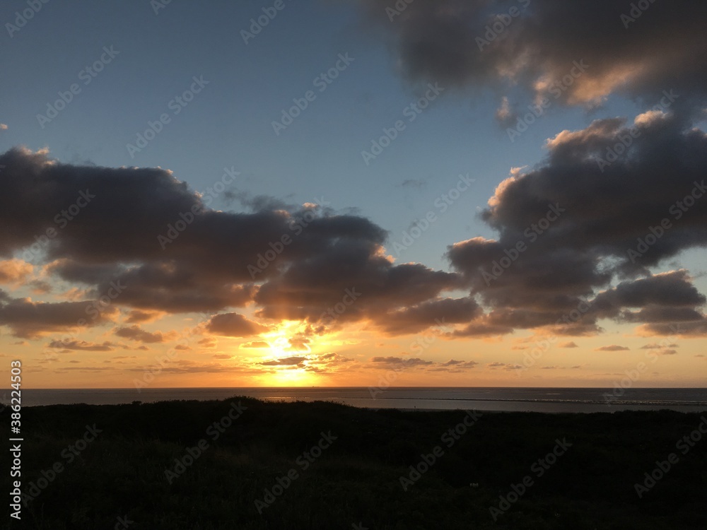 sunset on the beach of an island