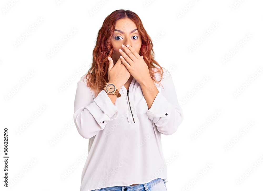 Young latin woman wearing casual clothes shocked covering mouth with hands for mistake. secret concept. Young latin woman wearing casual clothes shocked covering mouth with hands for mistake. secret concept.