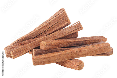 Tela Pile of sandalwood sticks isolated on a white background