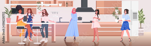 mix race pregnant women discussing during meeting girls spending time together pregnancy motherhood friendship concept kitchen interior full length horizontal vector illustration